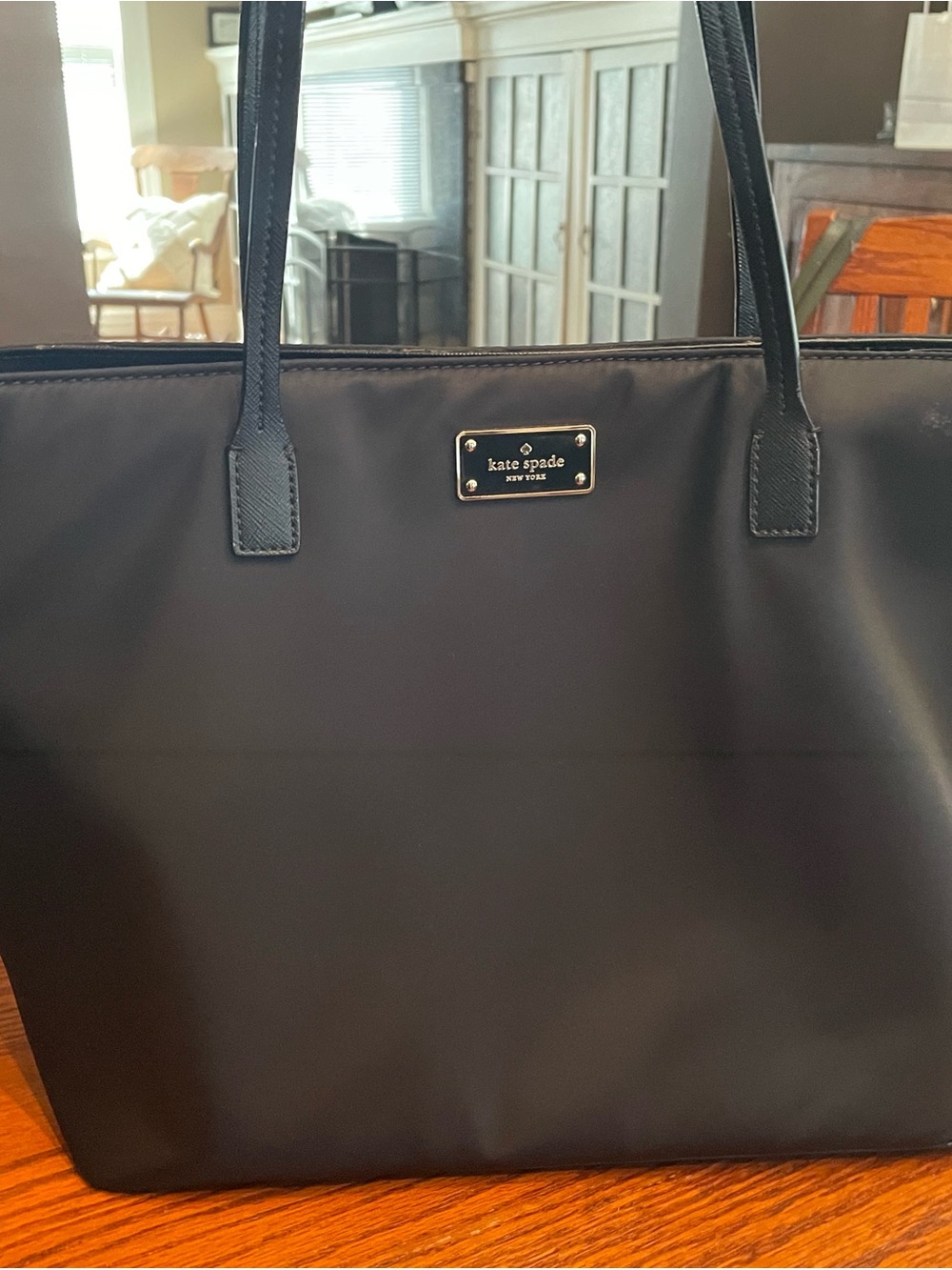kate spade black tote with gold plaque
